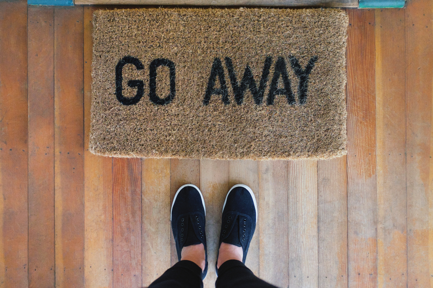 Doormat that reads “Go Away” placeholder